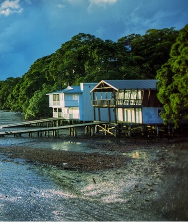 house on the water with a long dock